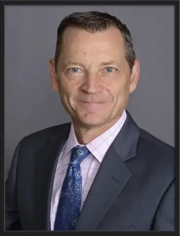 Professional portrait of Eric L. Lange, partner at Nolan and Lange Law Offices