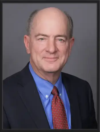 Professional portrait of Thomas E. Ryan, attorney at Nolan and Lange Law Offices
